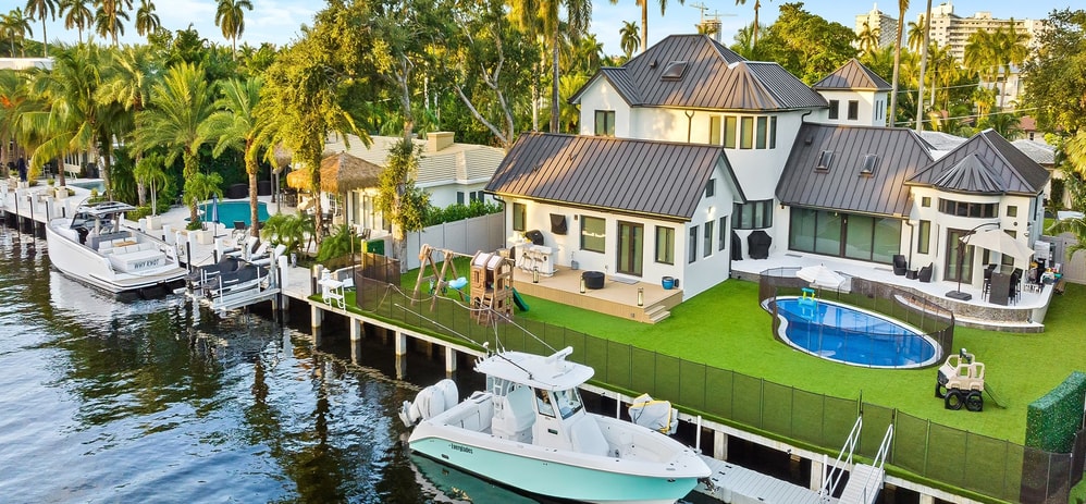 New construction impact window installation — two-story custom build with circular tower Fort Lauderdale
