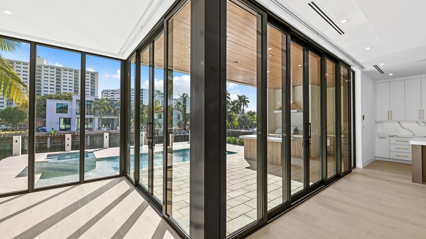 Floor-to-ceiling corner glass impact windows — 2412 Delmar Pl, Fort Lauderdale new construction