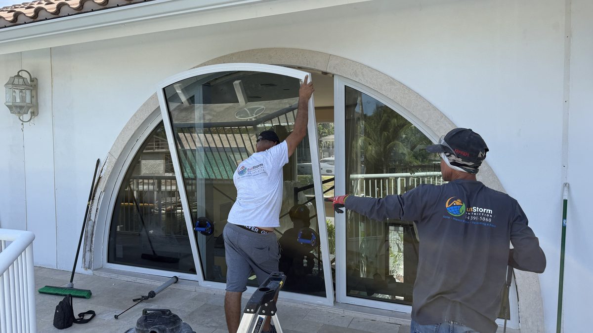 SunStorm three-man crew setting arched impact window — 530 Lido Dr, Fort Lauderdale
